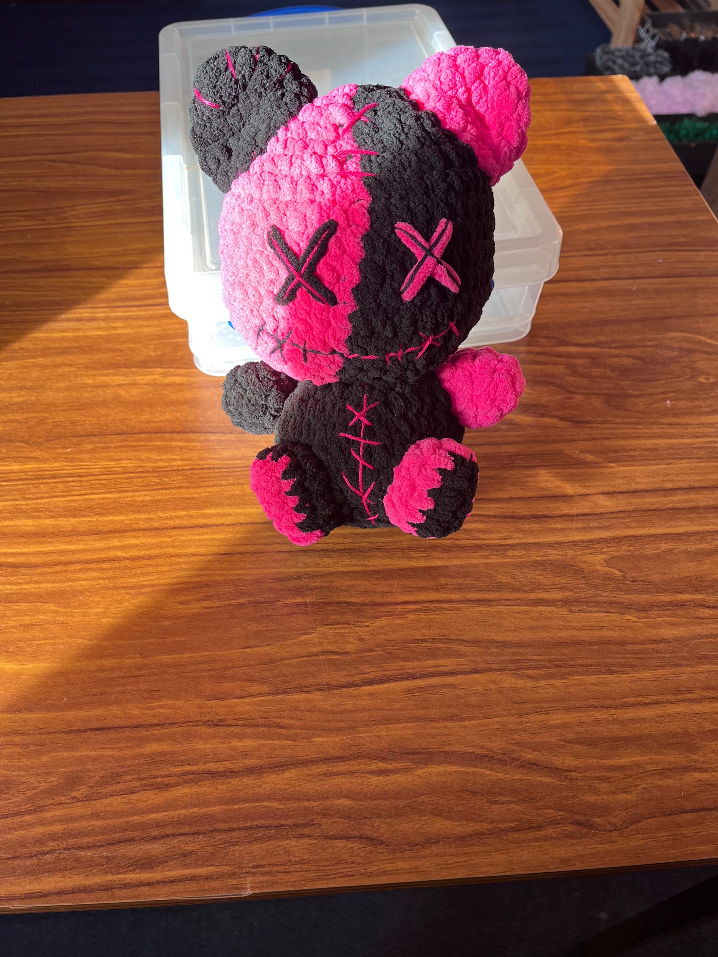 Pink and black bear