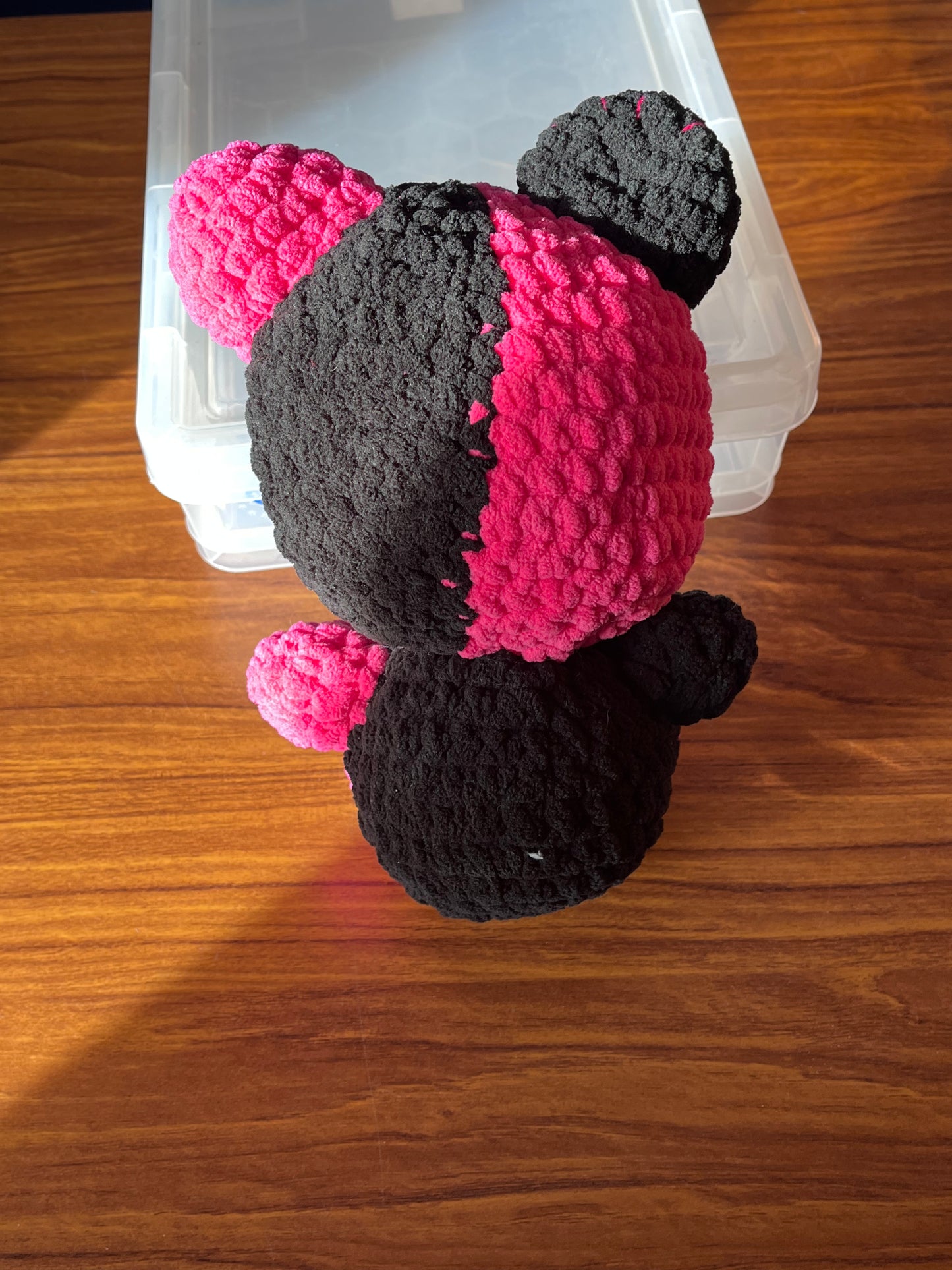 Pink and black bear