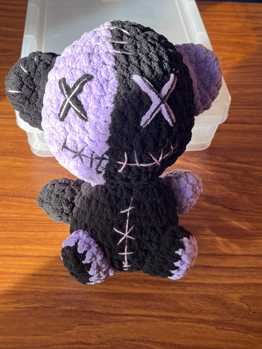 Purple and black bear